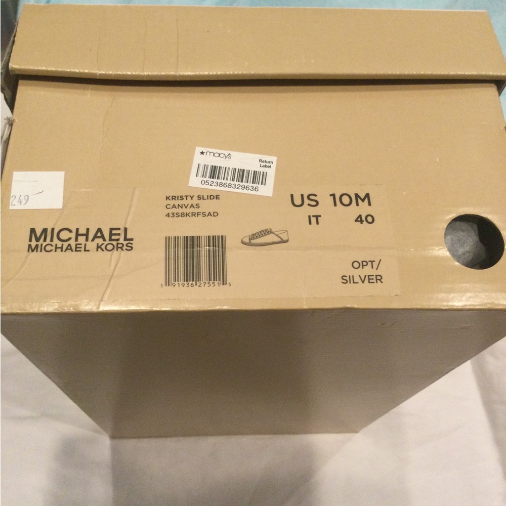 Woman’s Michael Kors dressed up sneakers